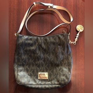 Michael kors medium brown and tan crossbody leather bag.